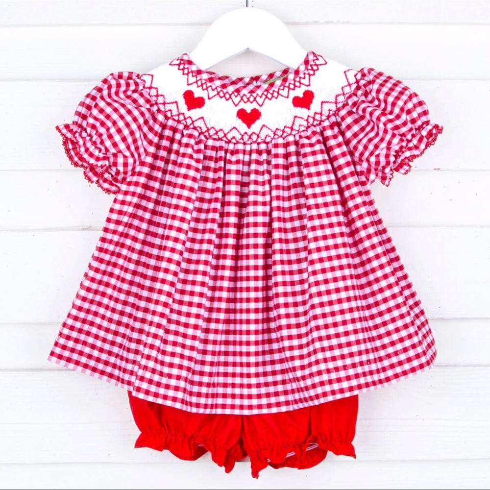 classical whimsy. worn once for pictures.  Smocked heart outfit with bloomers.